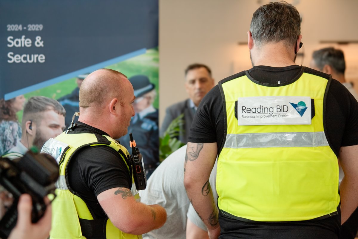 Business wardens talking at a conference in Reading